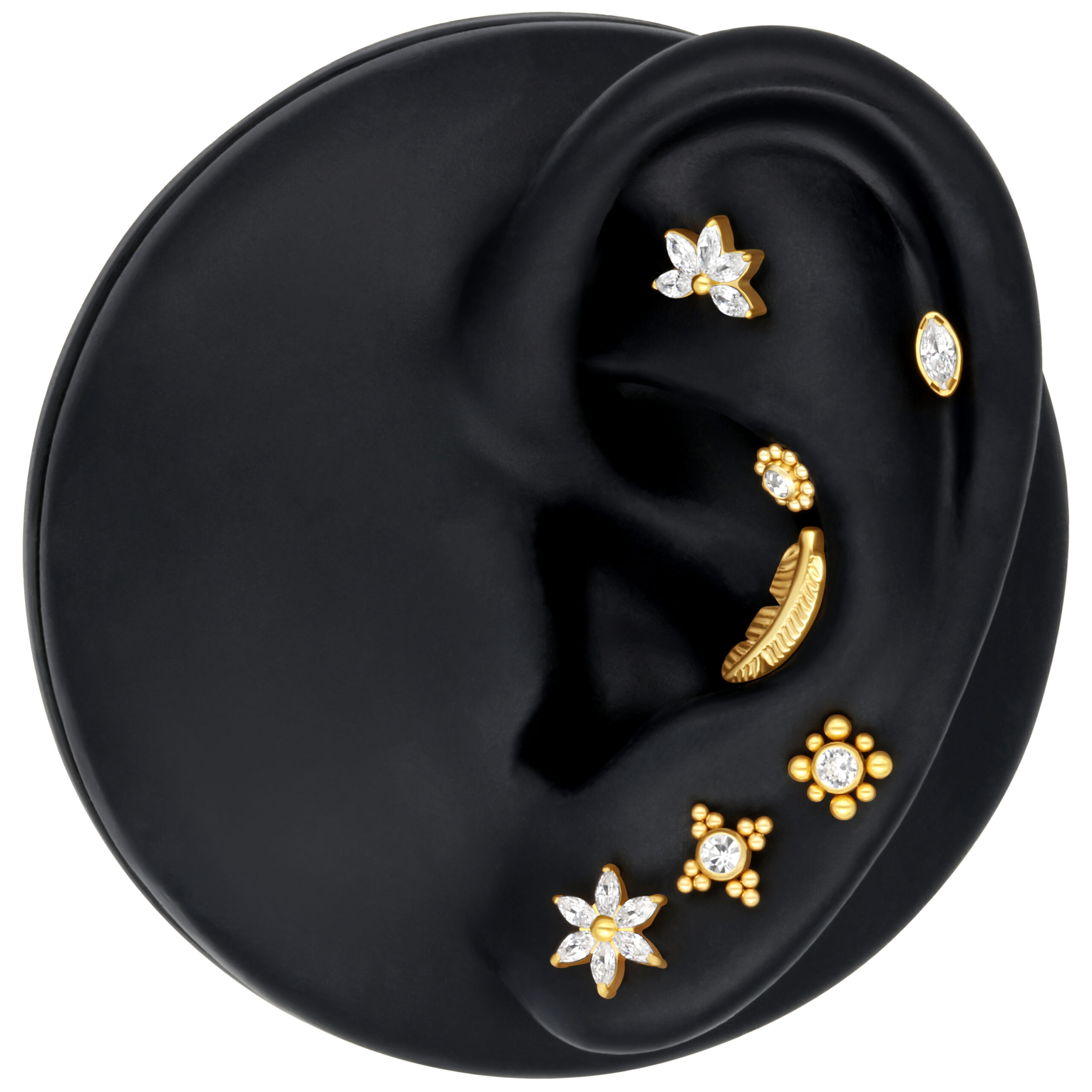 Hibiskus-förmiger Aufsatz in Silber und Gold auf schwarzem Ohrmodell