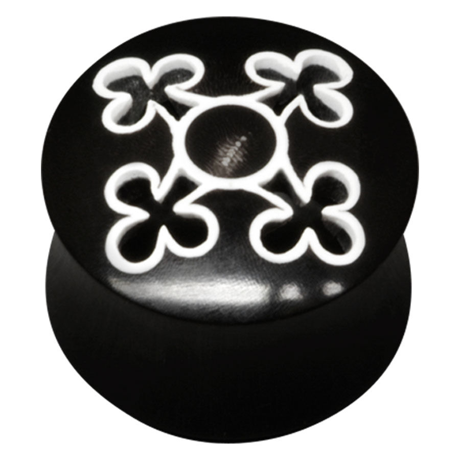 Schwarzer Horn Tunnel mit weißem Muster Schwarzer Horn Tunnel mit weißem, kreuzförmigem Muster auf schwarzem Hintergrund