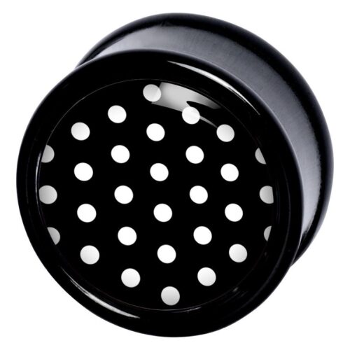 Schwarzer PMMA Plug mit weißen Polka Dots auf schwarzem Hintergrund
